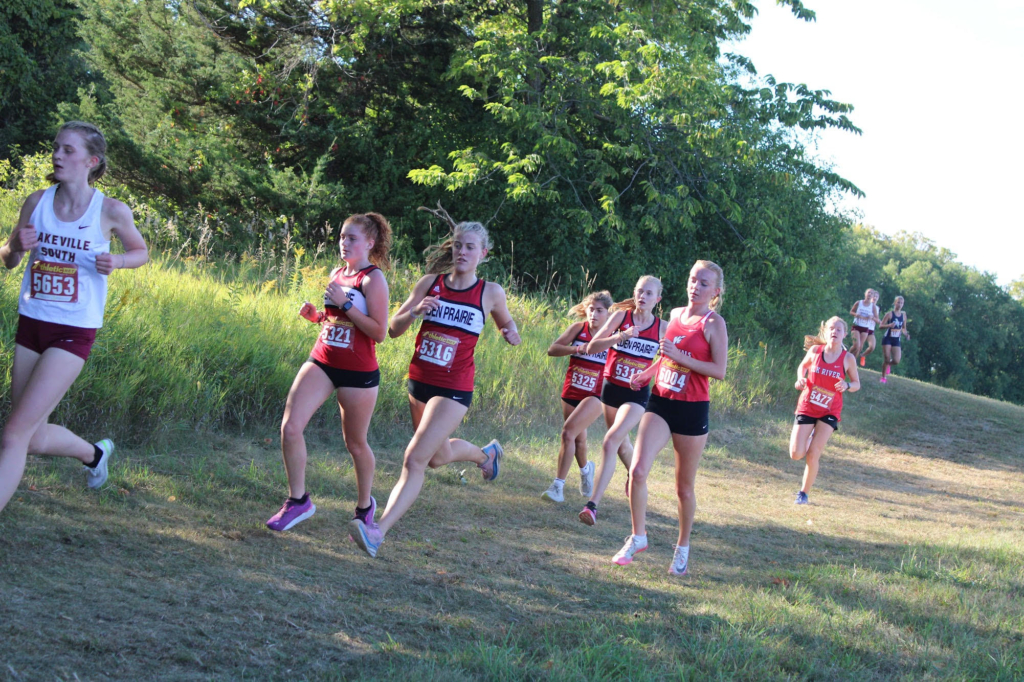 Great pack running in Hopkins girls varsity race. (L-R) Audrey Gaffin, Ani Dirks, Sedona Lashkowitz, and Erica Forsyth. Photo by Steve Meendering